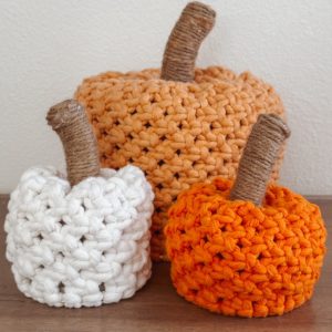 close up of three macrame pumpkin decor pieces