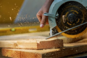 Woman using circular saw