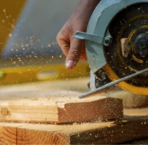 Woman using circular saw