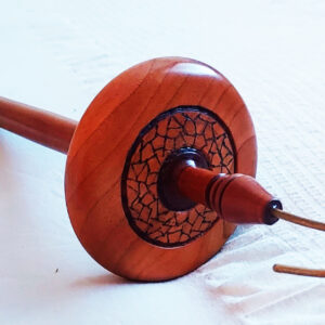 close up of handmade woodturned drop spindle