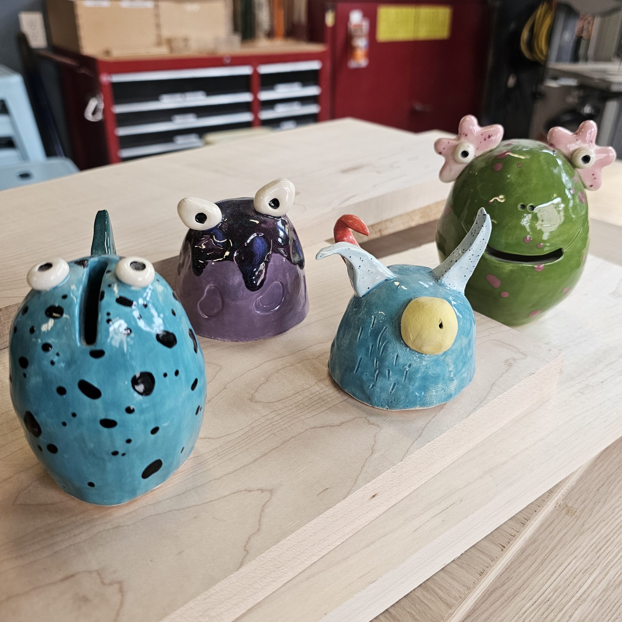4 unique ceramic glazed monsters